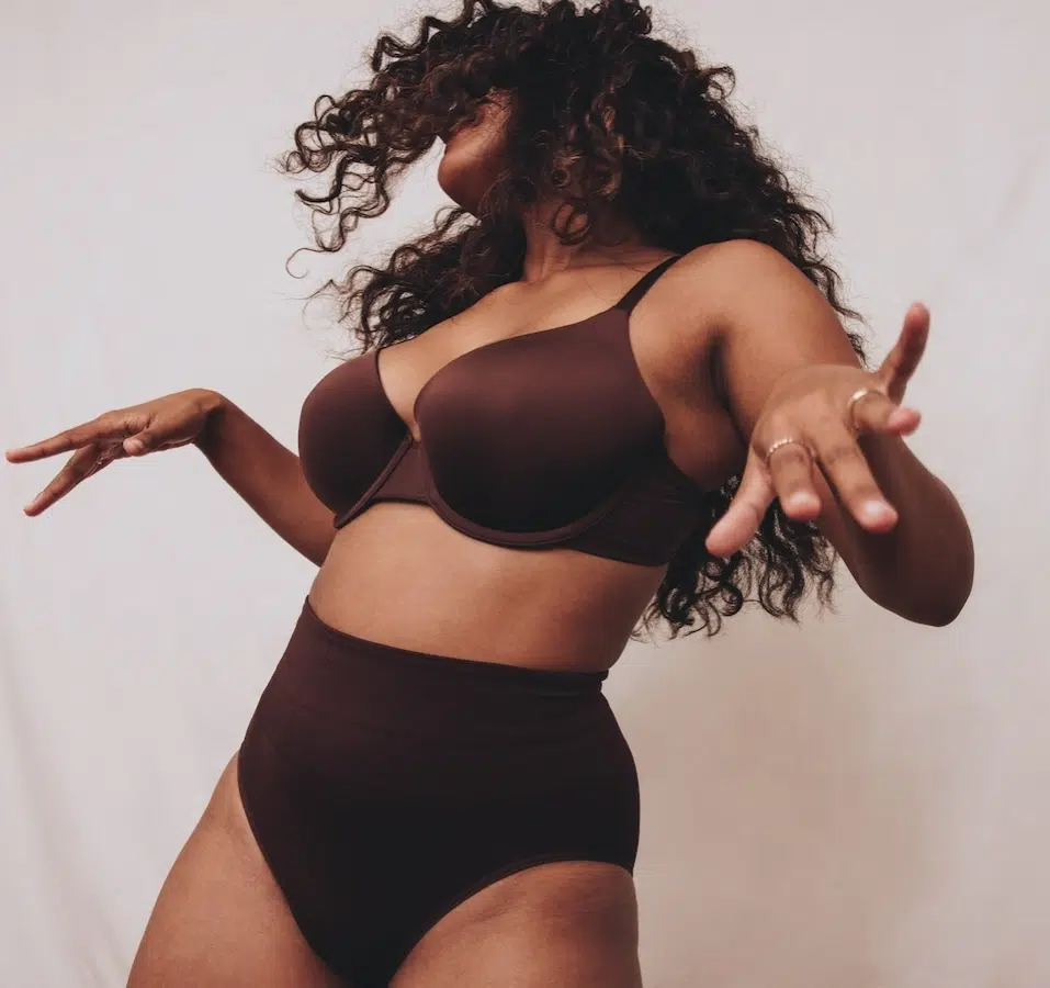 young woman in brown bra and underwear dancing young woman in brown bra and underwear dancing